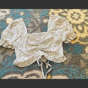 White crop top with black polka dots